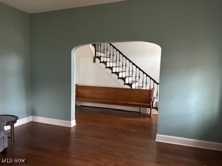 stairs with hardwood / wood-style flooring