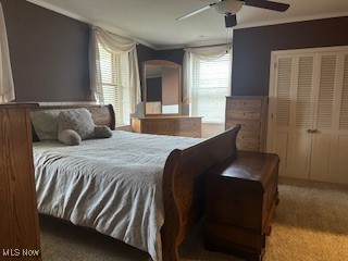 carpeted bedroom featuring ceiling fan