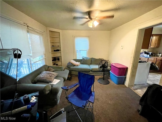 living room featuring plenty of natural light and light colored carpet