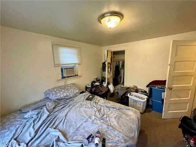 bedroom with cooling unit, dark carpet, a spacious closet, and a closet