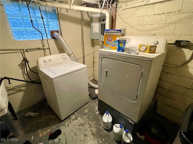 washroom with electric panel and separate washer and dryer