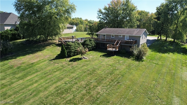 view of yard with a wooden deck