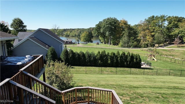 view of yard with a water view and a rural view