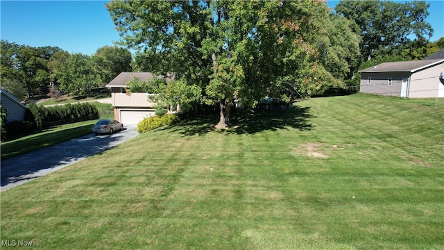 view of yard with a garage