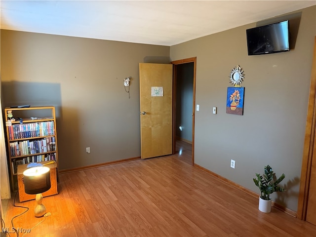 spare room featuring light hardwood / wood-style flooring