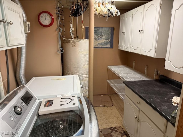 washroom featuring cabinets and a chandelier