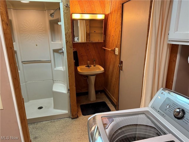 interior space featuring wood walls and washer / clothes dryer