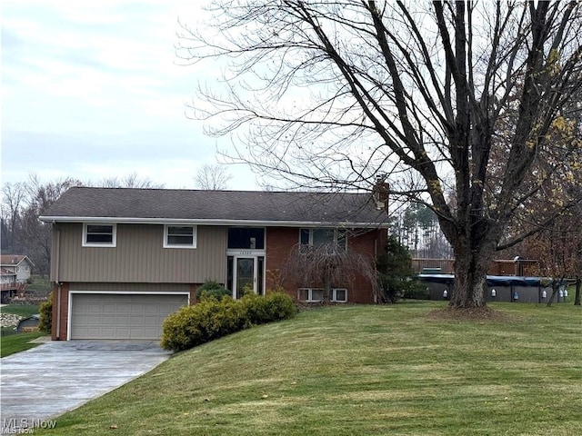 view of front of house with a front lawn and a garage