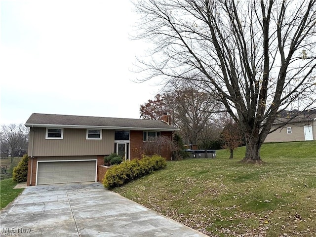 view of front of house featuring a front yard and a garage