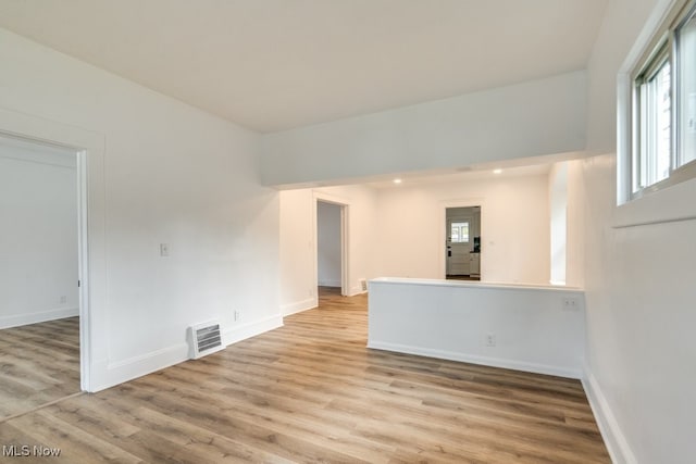 spare room featuring light wood-type flooring