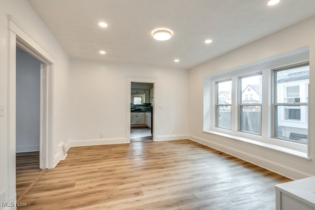 unfurnished room featuring light wood-type flooring