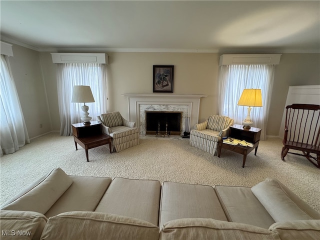 living room featuring carpet, a wall mounted air conditioner, crown molding, and a high end fireplace