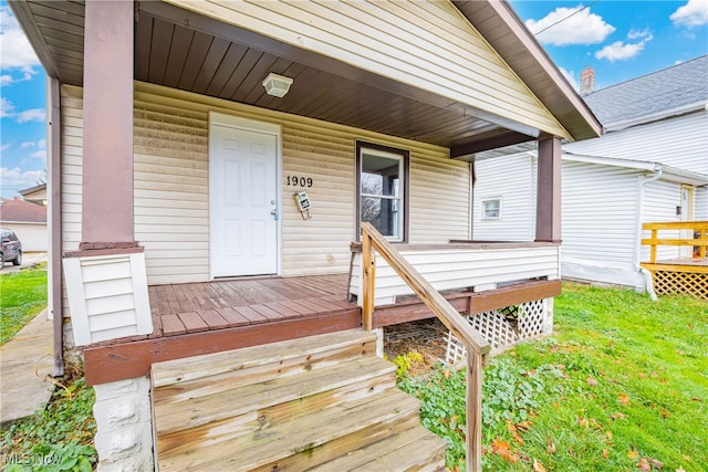 doorway to property with covered porch