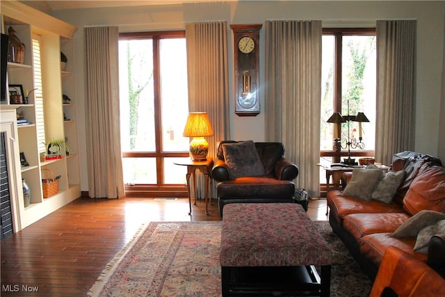 living room featuring hardwood / wood-style floors and a healthy amount of sunlight