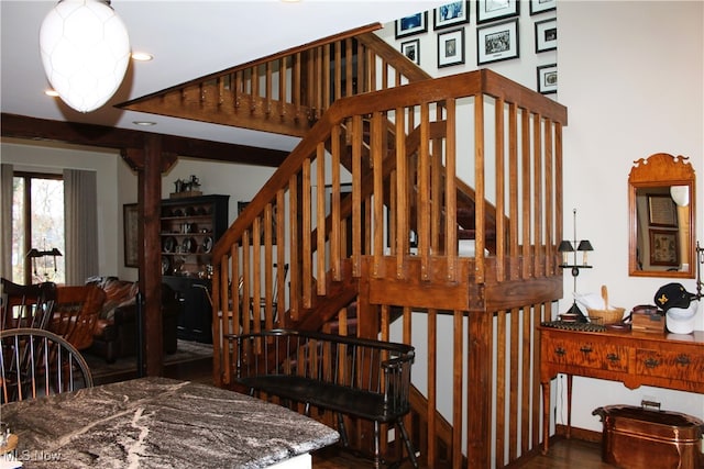 staircase with hardwood / wood-style flooring