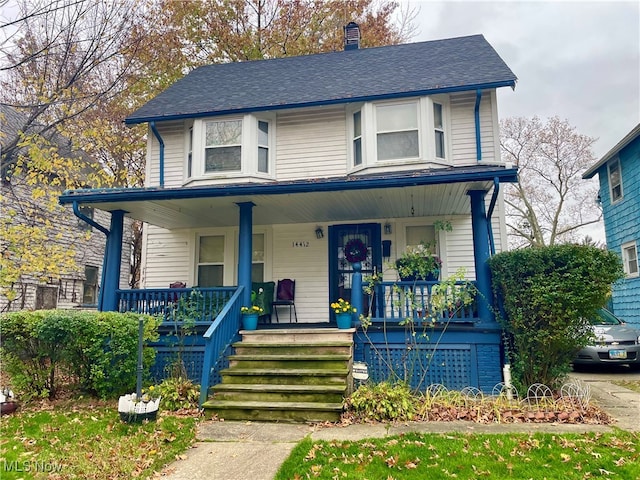 view of front of property featuring covered porch