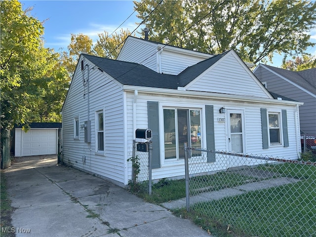 view of front facade with a garage and an outdoor structure