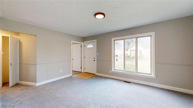 entryway with carpet flooring