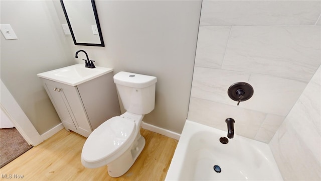 bathroom featuring vanity, toilet, and wood-type flooring