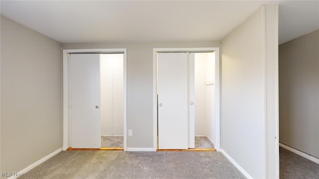 unfurnished bedroom with carpet flooring