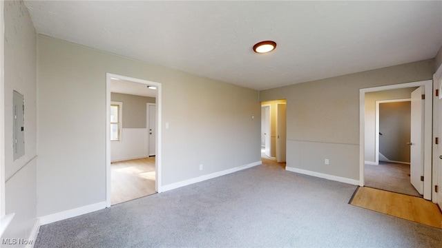 unfurnished bedroom with carpet floors and electric panel