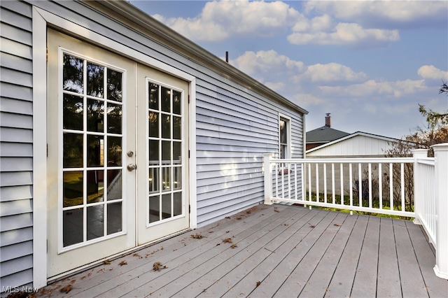 wooden deck featuring french doors