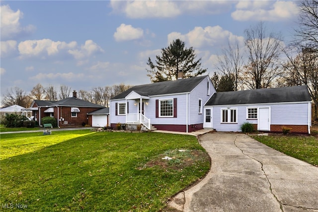 view of front facade featuring a garage and a front lawn