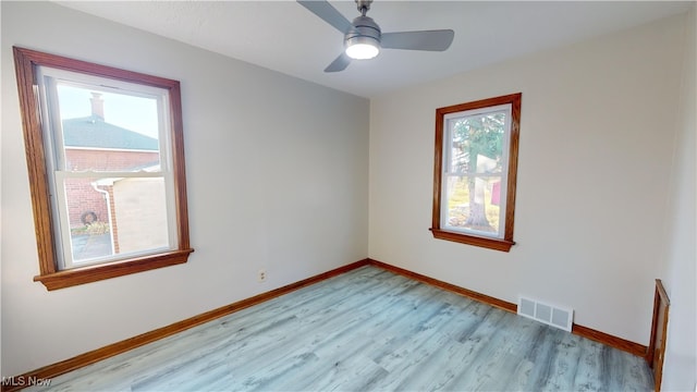 unfurnished room featuring ceiling fan and light hardwood / wood-style flooring