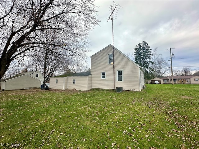 back of house with a yard