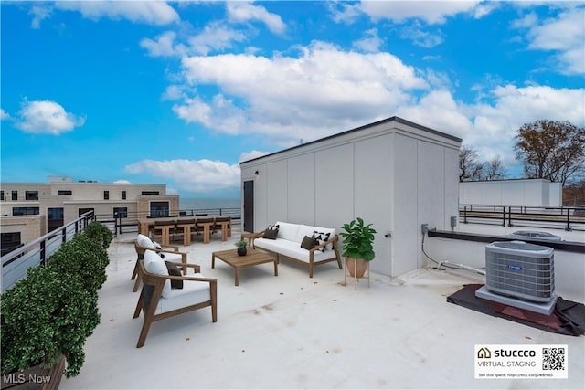 view of patio / terrace with central AC, a water view, and an outdoor hangout area