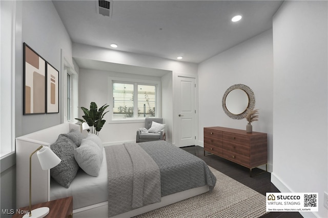 bedroom with dark wood-type flooring