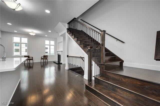 staircase featuring wood-type flooring