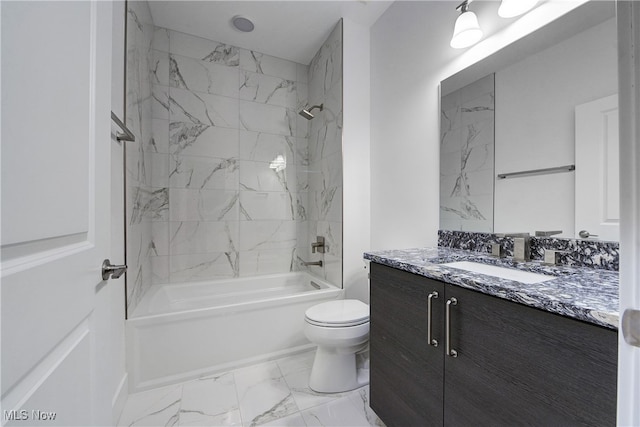 full bathroom featuring vanity, toilet, and tiled shower / bath