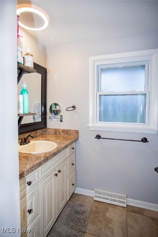 bathroom with tile patterned floors and vanity