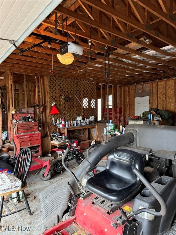 garage featuring a workshop area and a garage door opener