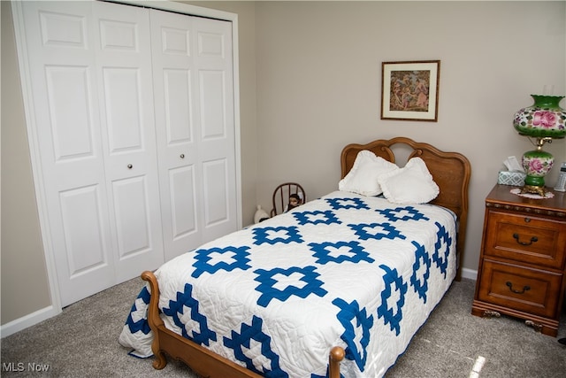 carpeted bedroom featuring a closet