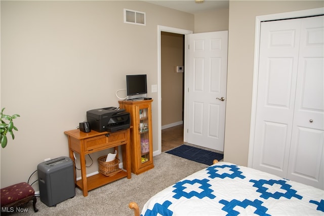 carpeted bedroom featuring a closet