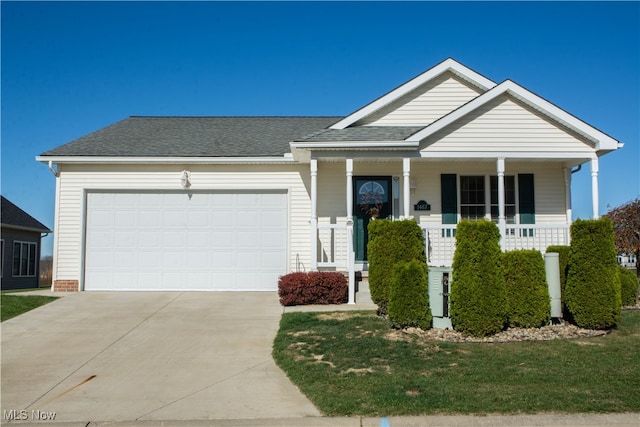 view of front of home with a porch and a garage