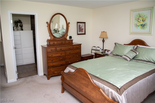 carpeted bedroom featuring a closet