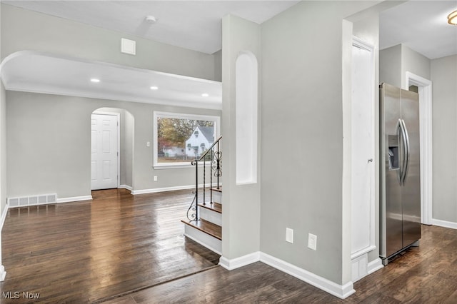 foyer featuring dark wood-type flooring