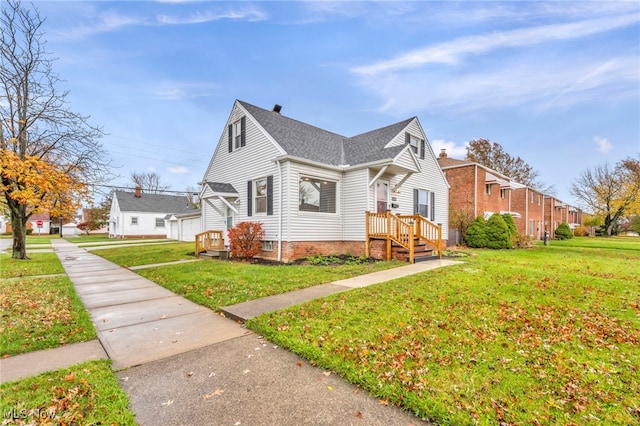 view of side of home with a yard