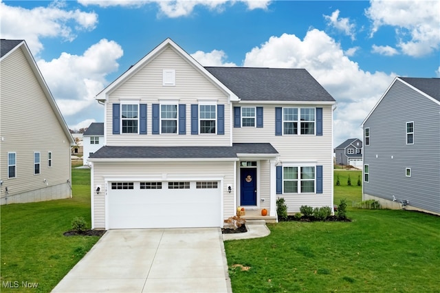 view of front of home with a garage and a front yard