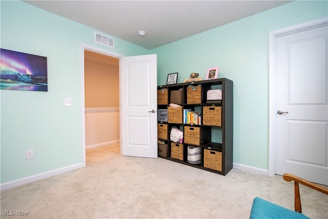 interior space featuring light colored carpet