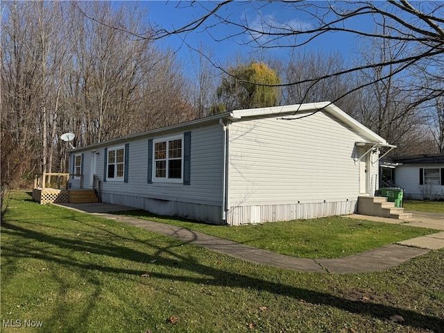 view of home's exterior with a yard