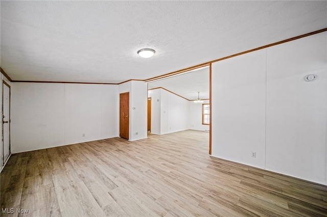 interior space with crown molding, a chandelier, light hardwood / wood-style flooring, and a textured ceiling