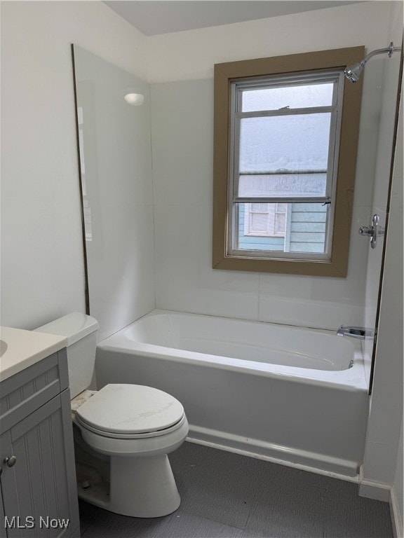 full bathroom with vanity, tub / shower combination, and toilet