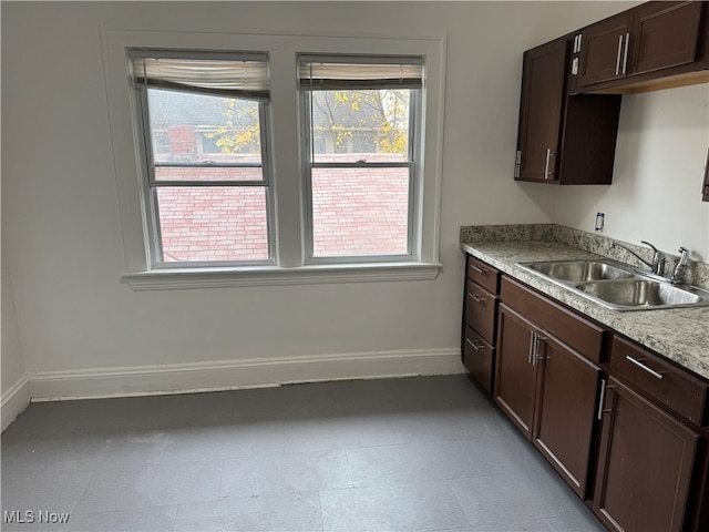 kitchen with sink and dark brown cabinets