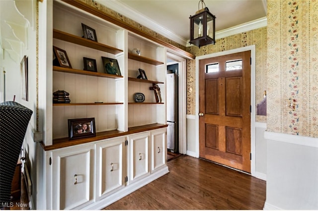 entryway featuring dark hardwood / wood-style flooring and ornamental molding