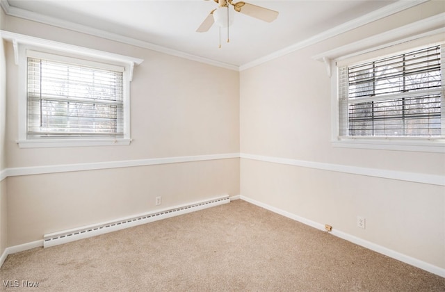 unfurnished room with ceiling fan, light colored carpet, crown molding, and a baseboard heating unit