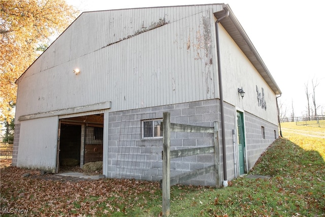 view of property exterior with an outbuilding